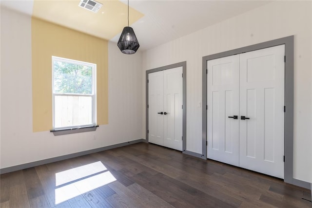 foyer entrance with dark wood-type flooring