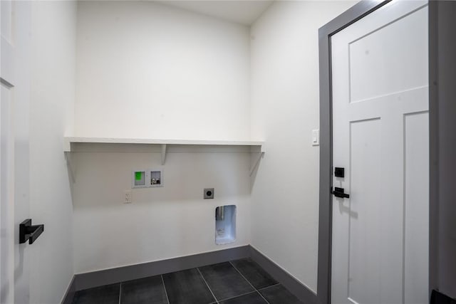 clothes washing area with hookup for an electric dryer, dark tile patterned floors, and hookup for a washing machine