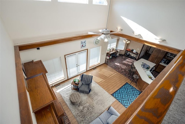 living room featuring high vaulted ceiling and ceiling fan