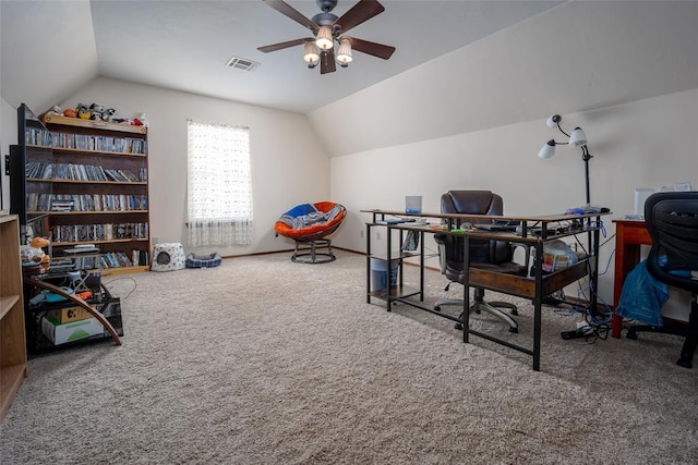 carpeted office space with ceiling fan and vaulted ceiling