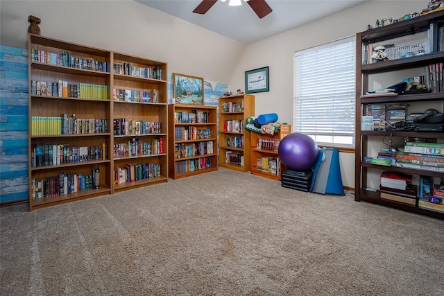 interior space featuring carpet, ceiling fan, and lofted ceiling