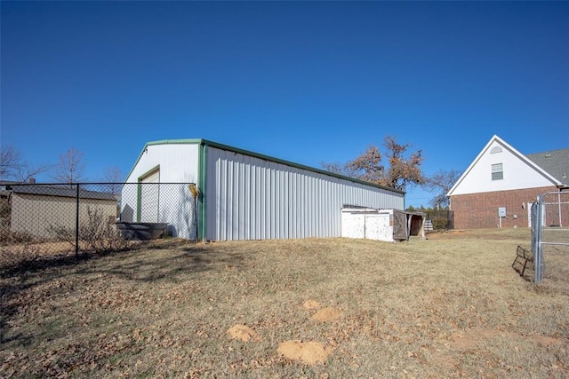 view of outbuilding with a lawn