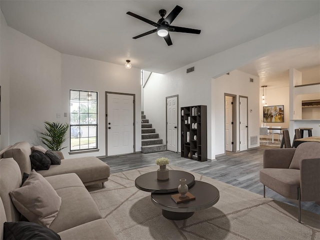 living room with ceiling fan and hardwood / wood-style floors