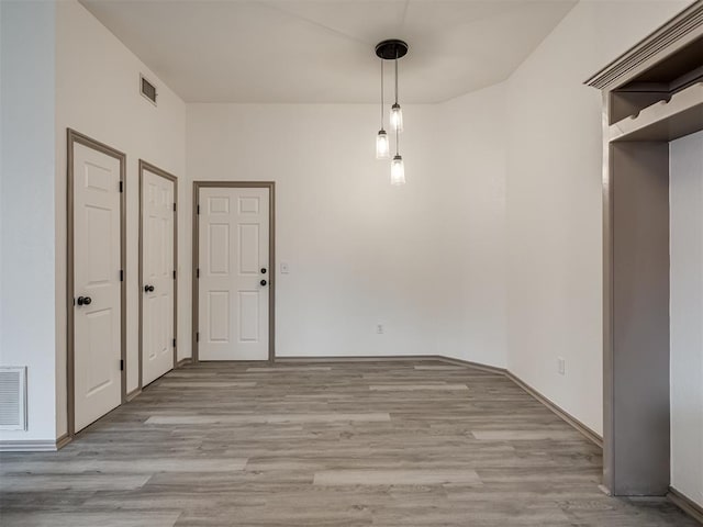 unfurnished dining area with light hardwood / wood-style floors