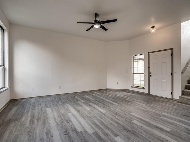 interior space with ceiling fan and light hardwood / wood-style floors