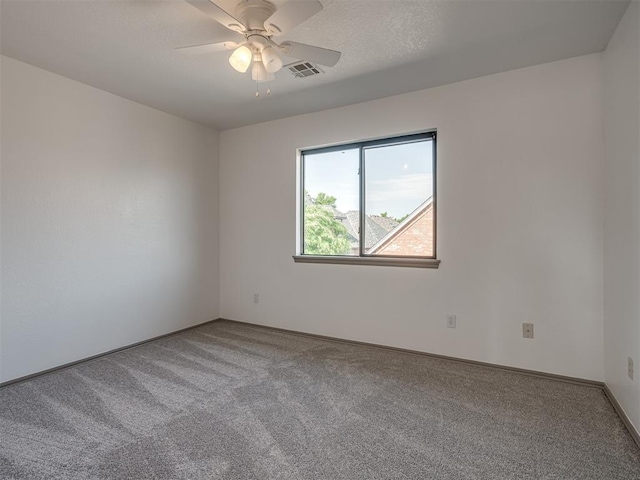 unfurnished room featuring carpet and ceiling fan