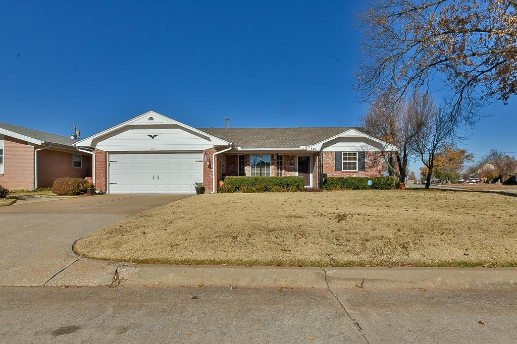 ranch-style house featuring a garage