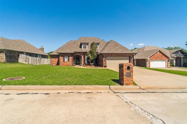 301 Club House Dr, Shawnee, OK 74801 - traditional-style house featuring driveway, brick siding, and a garage
