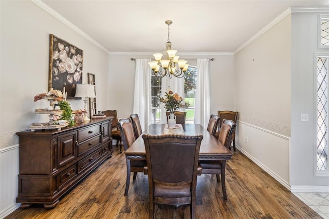 301 Club House Dr, Shawnee, OK 74801 - dining space with a chandelier, ornamental molding, wood finished floors, and a wainscoted wall