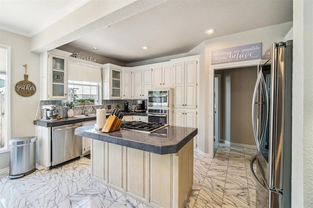 301 Club House Dr, Shawnee, OK 74801 - kitchen featuring appliances with stainless steel finishes, light marble finish floors, dark countertops, recessed lighting, and baseboards
