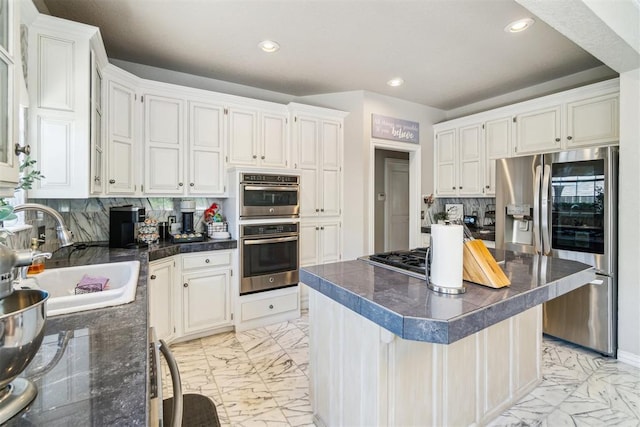 301 Club House Dr, Shawnee, OK 74801 - kitchen featuring stainless steel appliances, a sink, light marble finish flooring, recessed lighting, and decorative backsplash