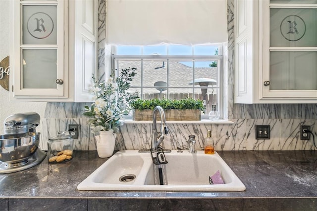301 Club House Dr, Shawnee, OK 74801 - kitchen featuring a sink, tasteful backsplash, glass insert cabinets, and white cabinets