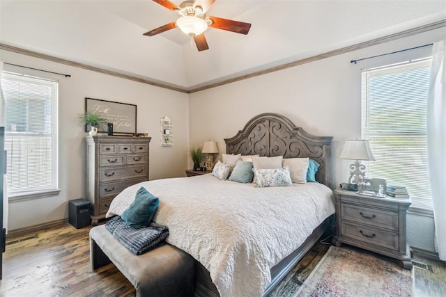 301 Club House Dr, Shawnee, OK 74801 - bedroom with wood finished floors, multiple windows, vaulted ceiling, and ceiling fan