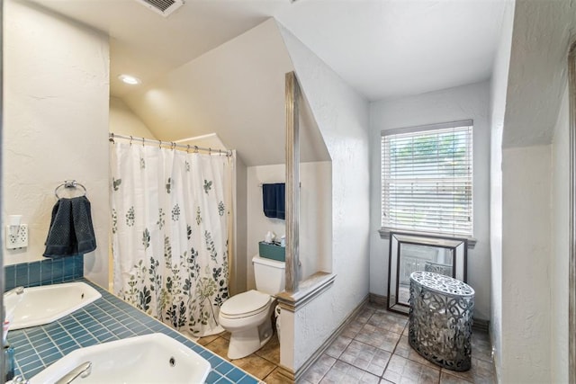301 Club House Dr, Shawnee, OK 74801 - bathroom with a sink, toilet, lofted ceiling, tile patterned flooring, and a shower with shower curtain