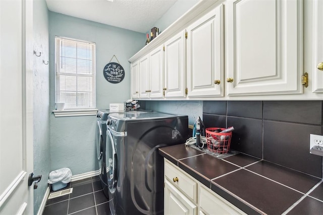 301 Club House Dr, Shawnee, OK 74801 - washroom featuring independent washer and dryer, cabinet space, tile patterned floors, and baseboards
