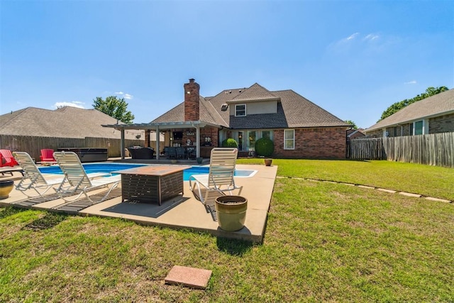 301 Club House Dr, Shawnee, OK 74801 - back of property with a patio, a chimney, brick siding, and an outdoor living space