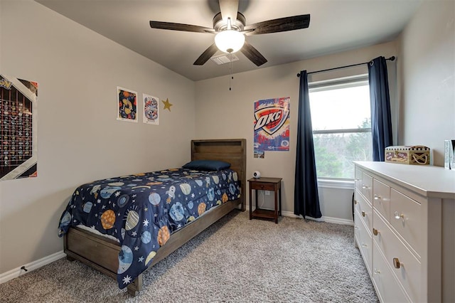 carpeted bedroom with ceiling fan and multiple windows