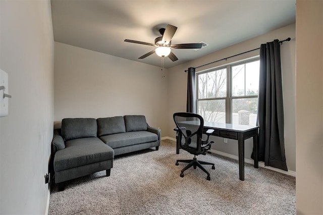 office space with ceiling fan and light colored carpet