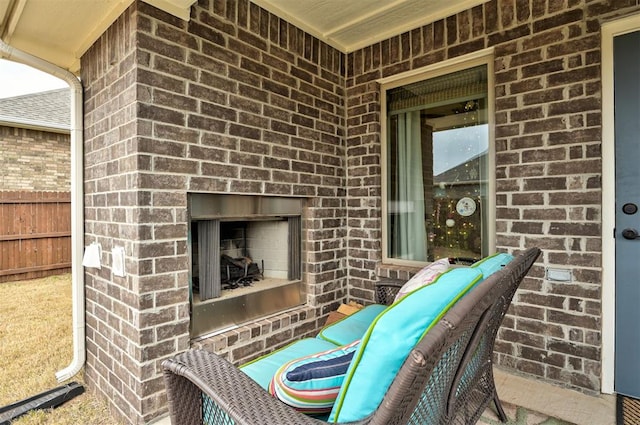 view of patio / terrace featuring an outdoor brick fireplace