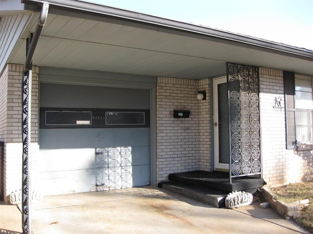 doorway to property featuring a garage