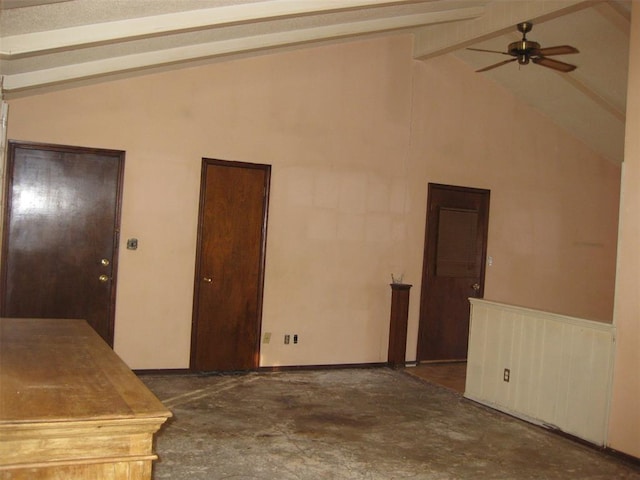 unfurnished room featuring vaulted ceiling with beams and ceiling fan