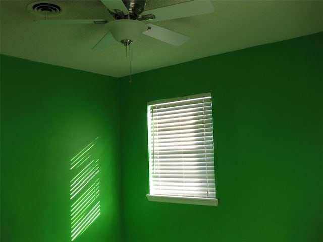 spare room with ceiling fan