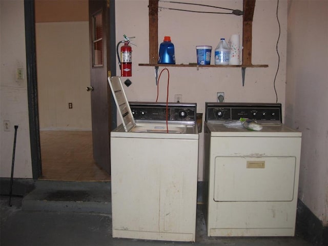 clothes washing area featuring washing machine and clothes dryer