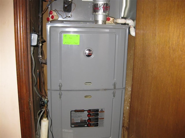 utility room with heating unit