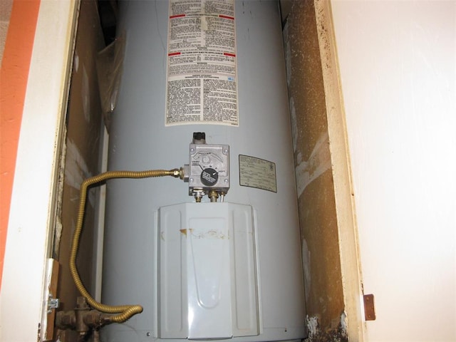 utility room featuring electric water heater