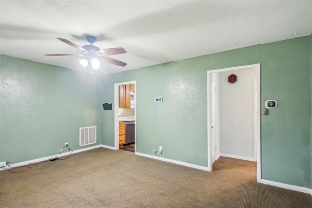 empty room featuring carpet and ceiling fan