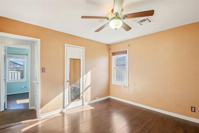 unfurnished room with hardwood / wood-style floors and ceiling fan