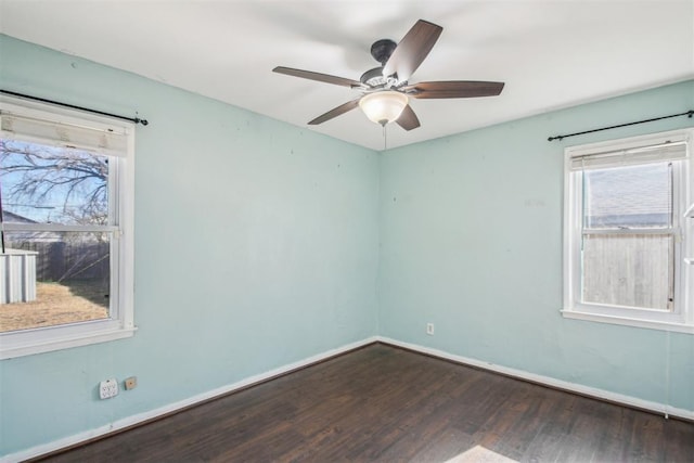 unfurnished room featuring ceiling fan and dark hardwood / wood-style flooring