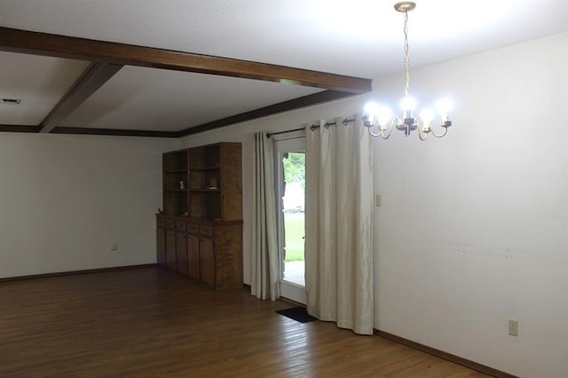 unfurnished dining area with beamed ceiling, dark hardwood / wood-style flooring, and a notable chandelier