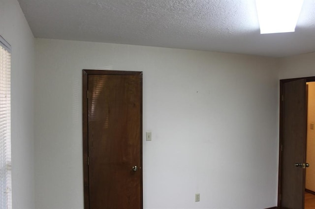 empty room with a textured ceiling