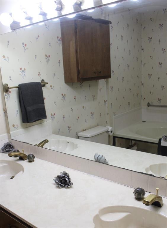 bathroom with vanity and toilet