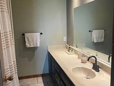 bathroom with vanity and tile patterned floors