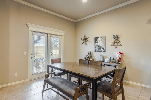 dining space featuring light tile patterned floors and ornamental molding