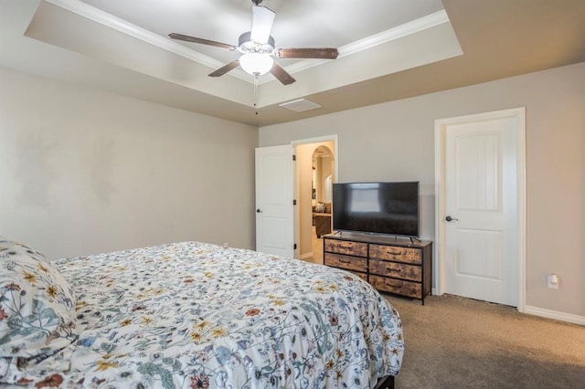 bedroom with carpet, ceiling fan, and a raised ceiling