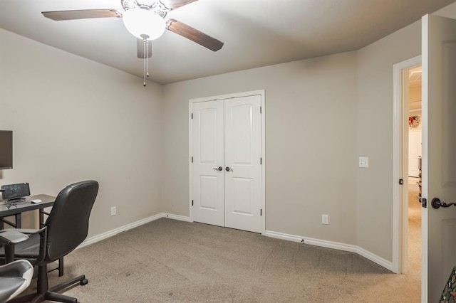 office with ceiling fan and light colored carpet