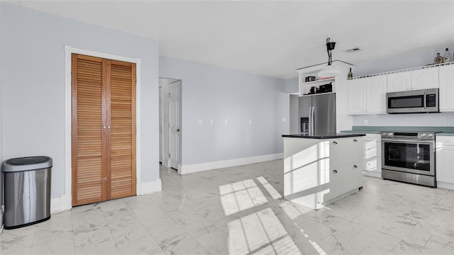 kitchen with white cabinetry and stainless steel appliances