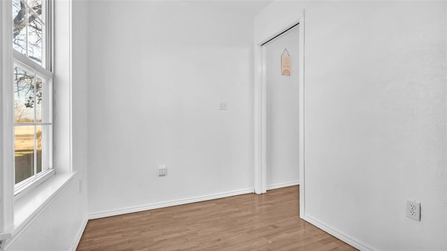 spare room featuring light hardwood / wood-style flooring