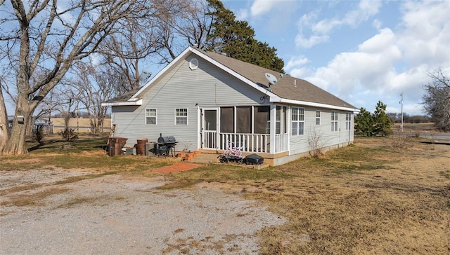 exterior space featuring a sunroom