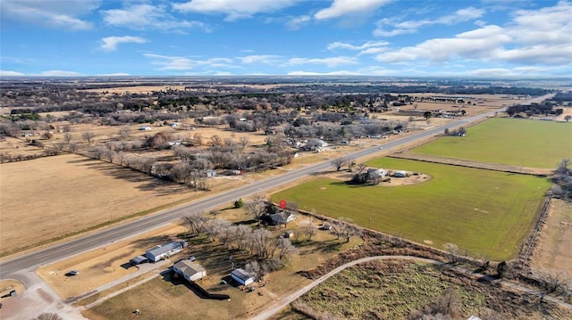 birds eye view of property featuring a rural view