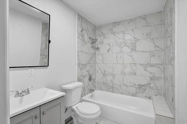 full bathroom with vanity, toilet, and tiled shower / bath