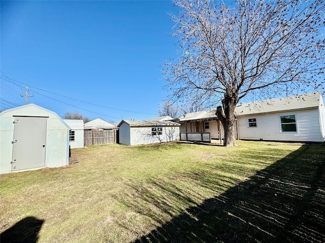 view of yard with a storage unit