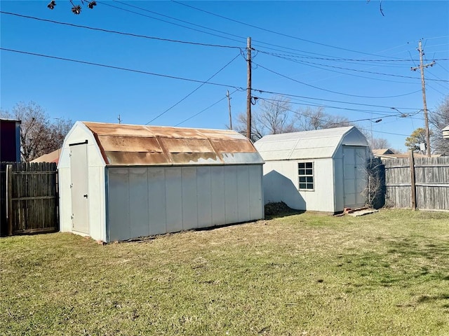 view of outbuilding with a yard