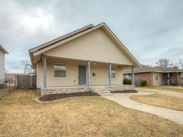 view of front of house featuring a front lawn and a porch