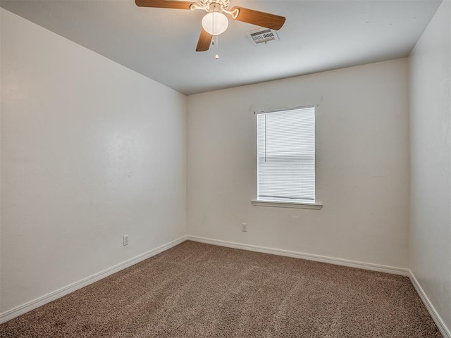 empty room with carpet and ceiling fan