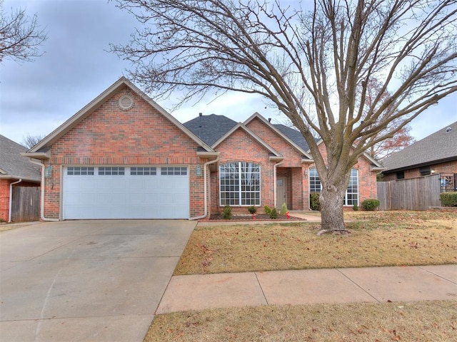 view of front facade with a front yard and a garage