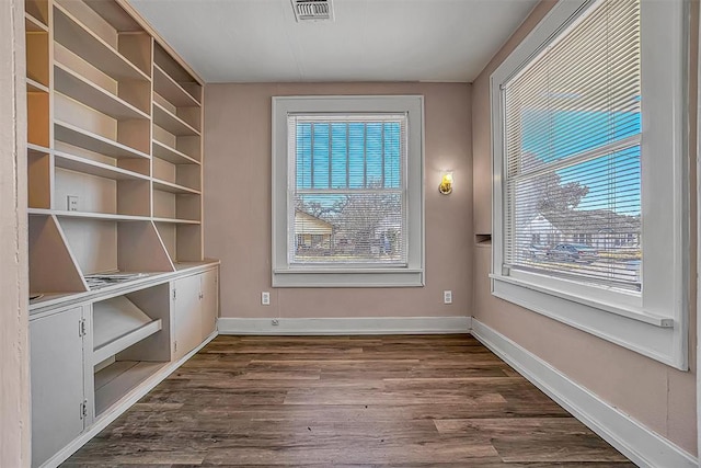 unfurnished room featuring dark hardwood / wood-style floors